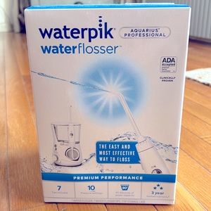 Waterpik water glosser —brand new, unopened